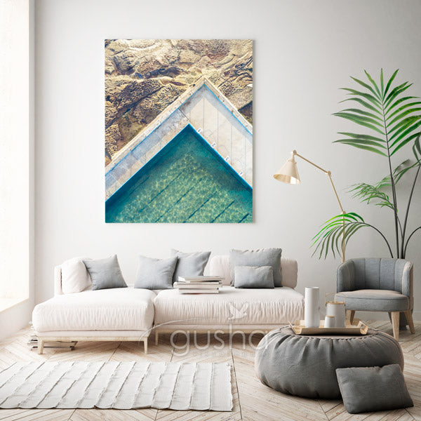 Beach canvas print hanging in lounge room